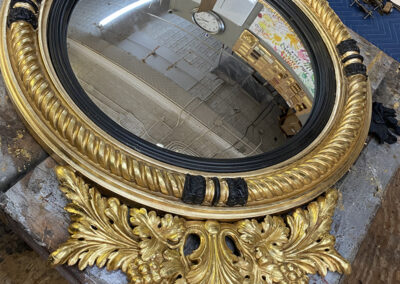 After the process of water gilding an 1810 bullseye mirror